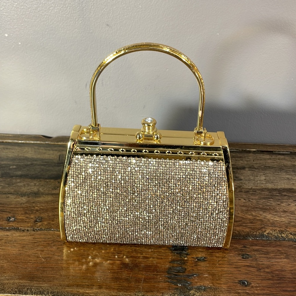 Phenomenal gold hard purse with shimmer and large rhinestone on clasp beautiful!